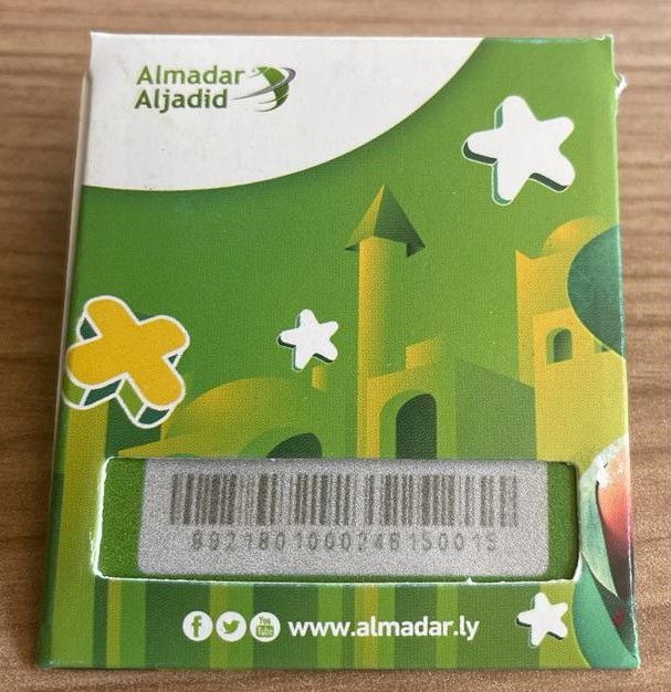 Green illustrated pack with a window showing the SIM card barcode